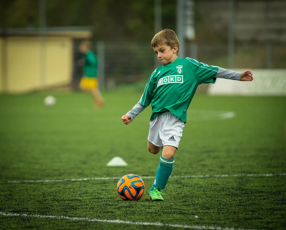 child, soccer, playing, kick, footballer, ball, football, sport, play, game, player, football player, athlete, football field, boy, kid, soccer, soccer, footbal